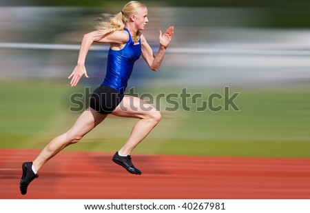 Young athlete running down the track with motion blur added