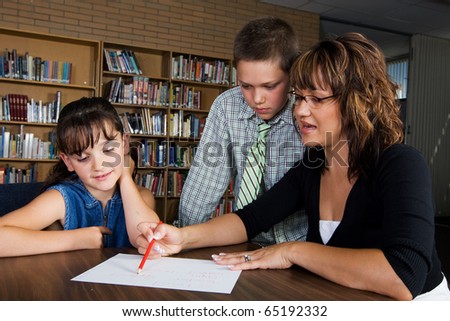 Teacher and students in a school library