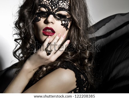 Face art make up black mask model with black dress flying
