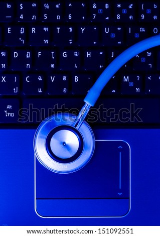 Medical stethoscope and a portable laptop. Medical Information and technology concept.