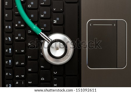 Medical stethoscope and a portable laptop. Medical Information and technology concept.