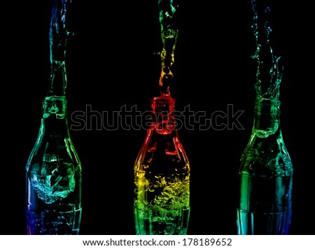 Bottled water colorful splash. Water splashes from a bottles.