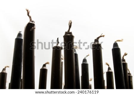 Candle wax black arranged. Candle sticks.