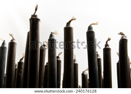 Candle wax black arranged. Candle sticks.