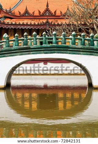 Traditional China style Buddhist church temple. Bridge over water