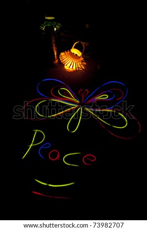KUALA LUMPUR, MALAYSIA-MAR 26:Glow-in-the-dark stick decoration by participant of Earth Hour Campaign on Mar 26, 2011 in Kuala Lumpur.More than 4,000 cities in 131 countries celebrate Earth Hour