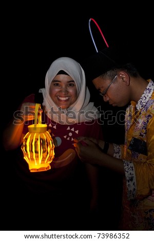KUALA LUMPUR, MALAYSIA-MAR 26: Unidentified participant light up lantern during Earth Hour Campaign on Mar 26, 2011 in Kuala Lumpur.More than 4,000 cities in 131 countries celebrate Earth Hour