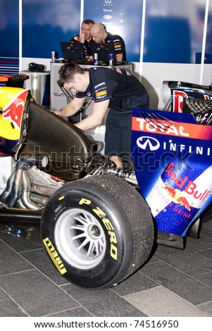 KUALA LUMPUR, MALAYSIA-APR 3:Team Red Bull inspecting the car after the F1 street demonstration end on Apr 3, 2011 in Kuala Lumpur.The event is a promotion for F1 Malaysia Grand Prix 2011