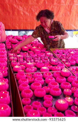 KUALA LUMPUR-JAN 23:Unidentified women pray at Guan Yin Temple during Chinese New Year celebrations on January 23, 2012 in Kuala Lumpur, Malaysia. In Chinese Horoscopes 2012 is the year of the Dragon.