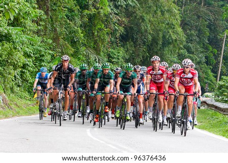 KUALA LUMPUR-FEB 29: The largest group of cyclists from various teams cycle during Stage 6 of the le Tour de Langkawi from Shah Alam to Genting Highlands on February 29, 2012 in Kuala Lumpur, Malaysia