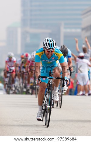 PUTRAJAYA, MALAYSIA - FEB 18: Unidentified cyclists from Kazakhstan team in the Elite Men\'s Road Race during the 32nd Asian & 19th Junior Asian Cycling Championships on Feb 18, 2012 in Putrajaya, Malaysia.