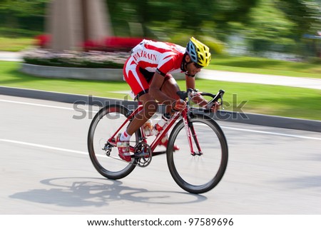 PUTRAJAYA, MALAYSIA- FEB 18: Unidentified cyclists from Bahrain team in the Elite Men\'s Road Race during the 32nd Asian & 19th Junior Asian Cycling Championships on Feb 18, 2012 in Putrajaya, Malaysia.