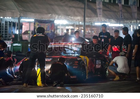 PATTAYA - NOVEMBER 30: Kiki Sak Nana\'s car being prepared for the race during Thailand Drift Series 2014 at Chayapruek, in Pattaya, Thailand on November 30, 2014.