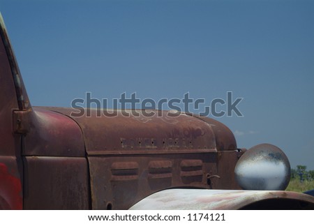 stock photo Detail of rusty old pickup truck on a blue sky background