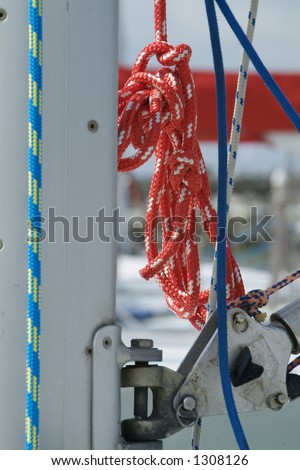 Red rope hanging from the mast of a racing yacht
