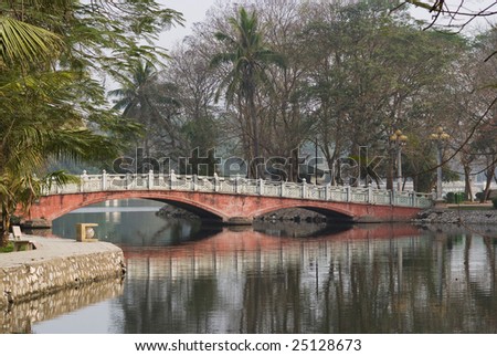 Bridge over the lake Ho Bay Mau in the Thong Nhat park in Hanoi, Vietnam.