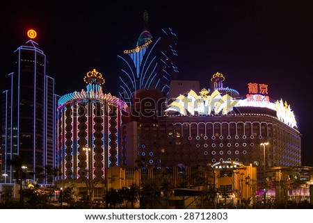 MACAU - NOVEMBER 22 : Night view of casinos neon signs November 22, 2008 in Macau. Macau, formerly a Portuguese colony is the gambling capital of Asia.