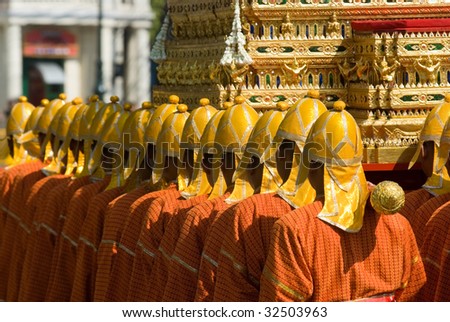 Thai soldiers in traditional uniforms during a royal funeral procession in Bangkok. Shallow depth of field.