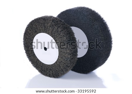 Black and gray, abrasive flap wheels with reflection, isolated on white.