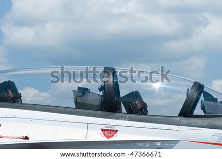 Cockpit canopy of white, two seater fighter jet