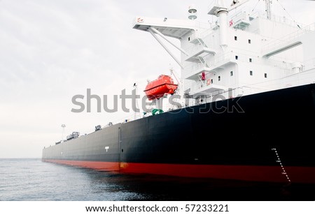 115,000 ton oil-tanker moored offshore.