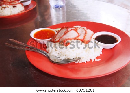 Chinese street food, Char siew rice as served at local restaurants all over Asia, in this case in Singapore.