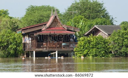 AYUTTAYA, THAILAND - OCTOBER 5: Traditional Thai house flooded during the monsoon season in Ayuttaya, Thailand on October 5, 2011.