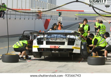 DUBAI - JANUARY 13: Car 30, a Lamborghini Gallardo LP600 during pit stop during the 2012 Dunlop 24 Hour Race at Dubai Autodrome on January 13, 2012.