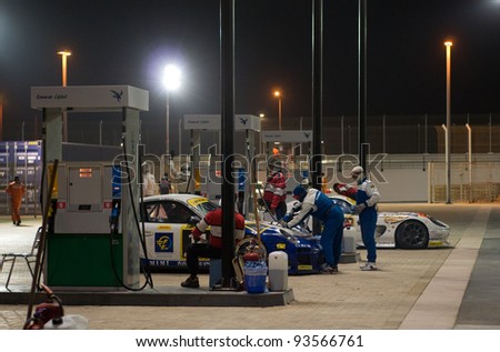 DUBAI - JANUARY 13: Re-fueling station for race cars in use during the 2012 Dunlop 24 Hour Race at Dubai Autodrome on January 13, 2012.