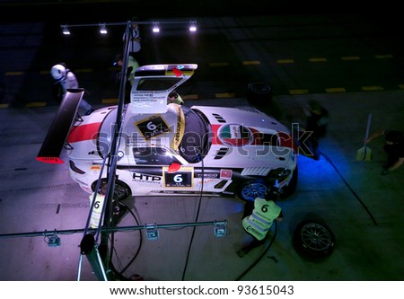 DUBAI - JANUARY 13: Aerial view of car 6, a Mercedes SLS AMG GT3 during pit stop at night at the 2012 Dunlop 24 Hour Race at Dubai Autodrome on January 13, 2012 in Dubai.