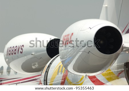 SINGAPORE - FEBRUARY 16: Engines of corporate jet airplanes on show during Singapore Airshow at Changi Exhibition Centre in Singapore on February 16, 2012.
