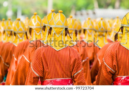 Thai soldiers in traditional uniforms during a parade in Bangkok, Thailand. Shallow depth of field with the nearest soldier in focus.