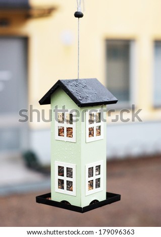 Bird feeders in the form of house