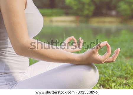 Yoga Meditating Zen Woman Relaxing Outdoor.Healthy Lifestyle in Lotus Posture .Unrecognizable caucasian female meditate.