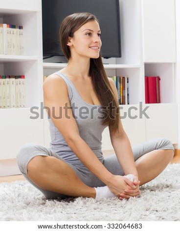 Fit Young Woman Relax at home. Yoga Meditation.Caucasian female relaxing at home. Healthy Lifestyle.