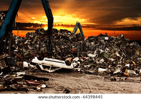 Car recycling to the dump.Dramatically scene at the sunset.