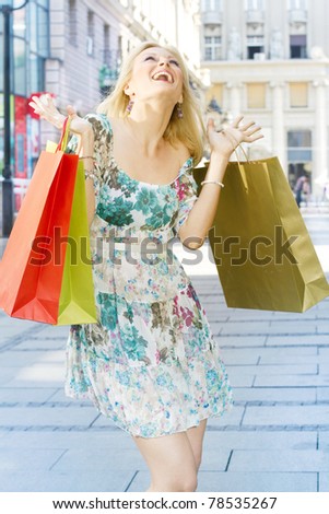 Attractive shopping woman with bags.
