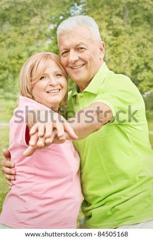 Portrait of happy old people outdoors.