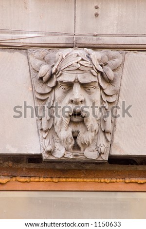 Male mask on the wall
