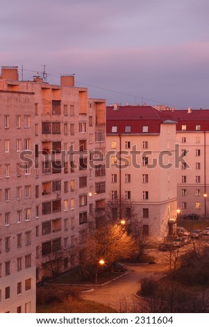City buildings in morning  lit by rising sun