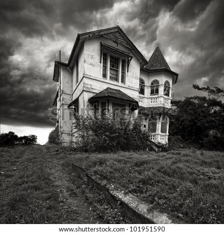 A derelict old house on top of a hill