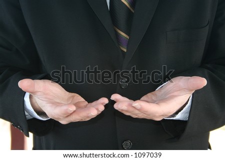 a man giving palms up to show he is giving helping hands to those in need