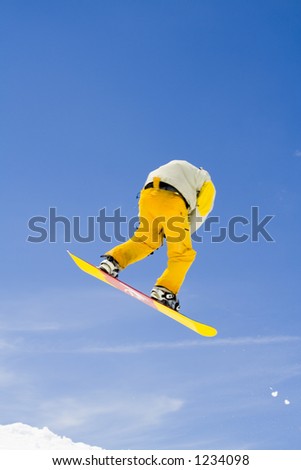 Snowboarder jumps in the air - professional