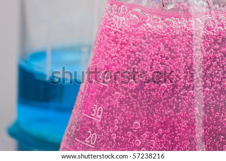 Lab chemistry - bubbles reaction in flasks - shallow DOF