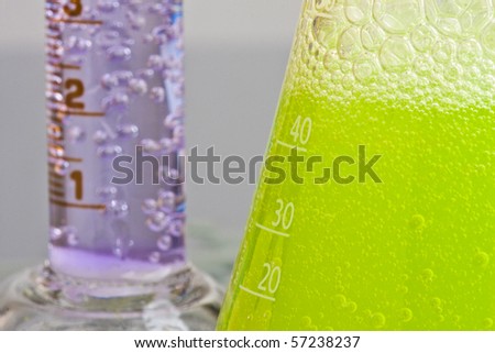 Lab chemistry - bubbles reaction in flasks - shallow DOF