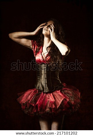 Horror shot: the strange girl with mouth sewn shut among the dark. Grunge texture effect