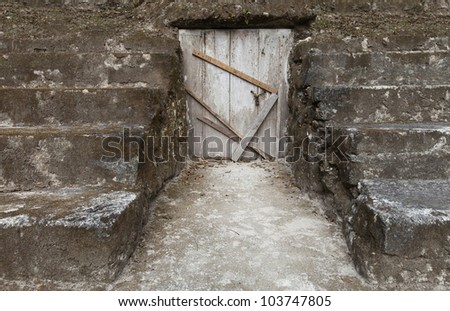 wooden door is closed, stairs around