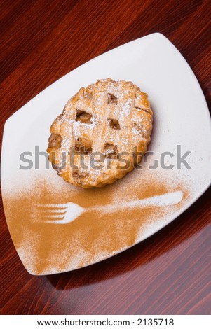Apple cake with silhouette of holder