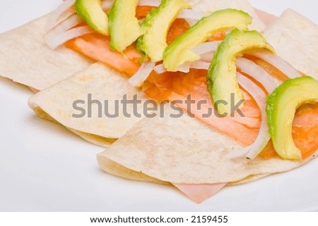 Mexican cuisine. Traditional ham quesadilla with cheese and avocado