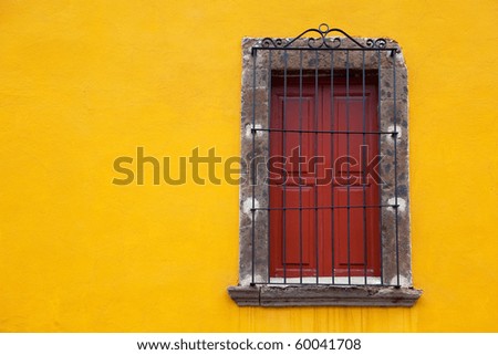 Old yellow window in old town. Mexico